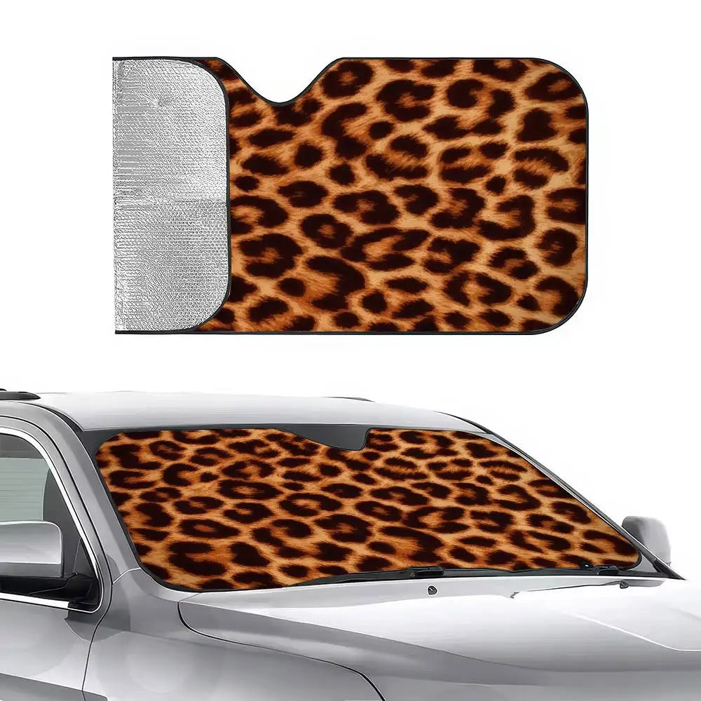 A leopard print car windshield sunshade placed on a silver car windshield.