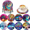 A set of sparkling diamond painting coasters featuring vibrant nature scenes and a decorative holder.