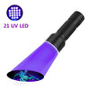 A purple UV LED flashlight is shown illuminating a green insect on a white background.