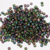A pile of colorful acrylic alphabet letter beads in various shades and shapes for jewelry making