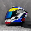 A modular flip-up motorcycle helmet in white, black, and yellow with a blue visor displayed against a gray background.