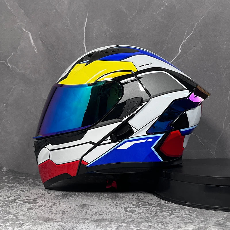 A modular flip-up motorcycle helmet in white, black, and yellow with a blue visor displayed against a gray background.