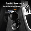 A black push-to-start joystick accessory with a billiard ball design installed in a car interior.