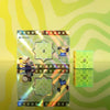A set of GAN16 Maglev Smart 3x3 Speed Cubes displayed against a bright yellow and green striped background.
