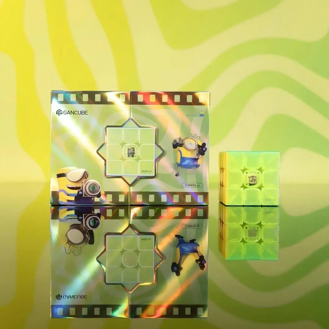 A set of GAN16 Maglev Smart 3x3 Speed Cubes displayed against a bright yellow and green striped background.