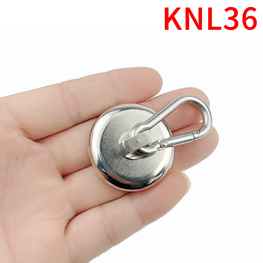 A hand holds a silver heavy duty neodymium magnetic hook with a swivel carabiner.