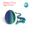 A green dragon figurine with a large egg, measuring 25 cm long and 8.5 cm wide.