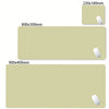 A set of oversized non-slip desk mats in beige and olive green colors with included mousepads.