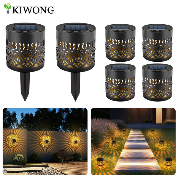 A black solar-powered mandala wall light fixture with a decorative perforated design and a golden glow.