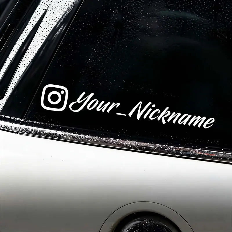 A close-up of a black motorcycle helmet featuring a white Instagram logo and the text Your_Nickname decal.