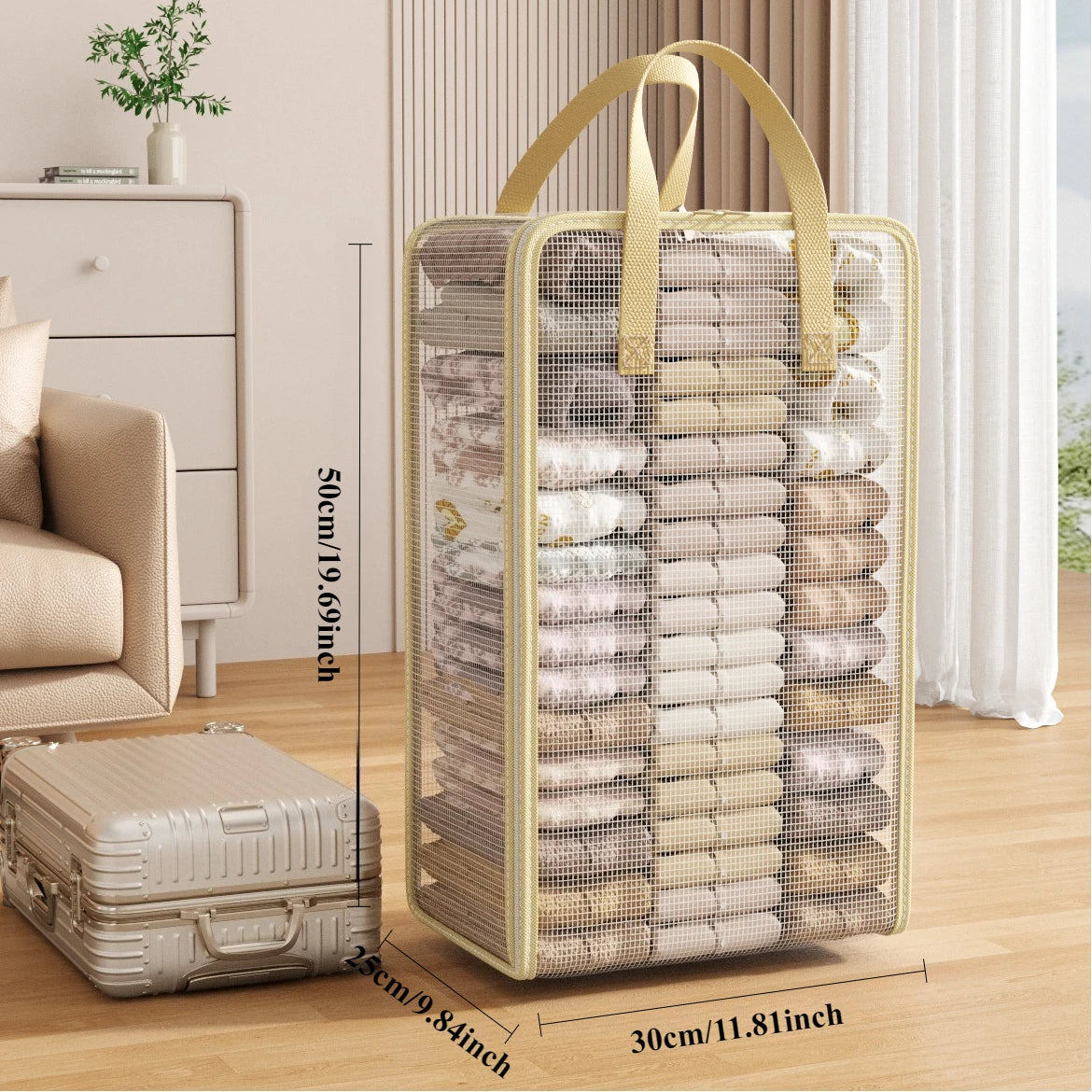 A beige mesh storage bag with handles is displayed next to a suitcase, showing its size and texture.