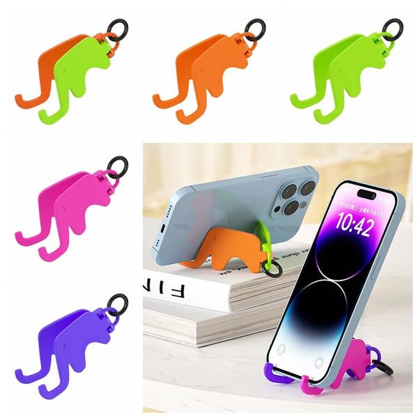 Soportes plegables de teléfono en forma de elefante de varios colores mostrados sobre un fondo blanco.