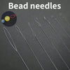 A set of ultra-fine beading needles for jewelry making displayed on a dark surface.