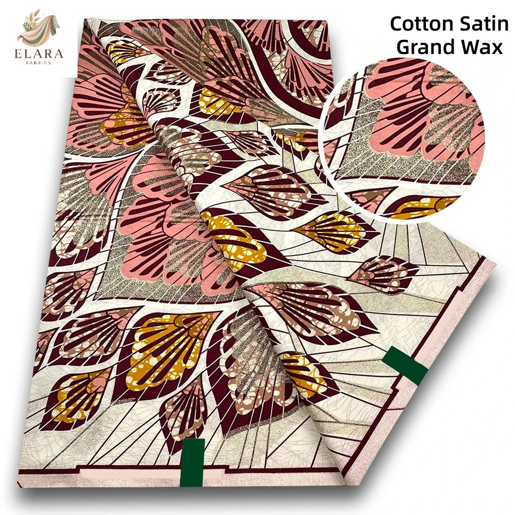 Roll of Cotton Satin Grand Wax fabric featuring a pink and brown African print design