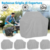 Gray heavy duty waterproof grill cover protecting a gas grill outdoors.