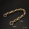 A gold-colored acrylic chain strap measuring 60cm is displayed against a dark background.