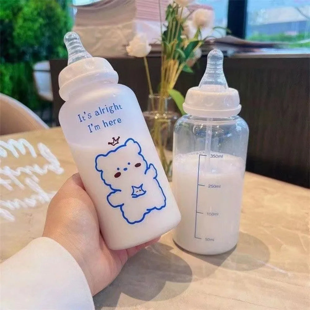 A hand holds a white plastic bottle with a blue outline of a bear and the text It's alright I'm here