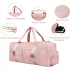 Pink nylon gym and travel duffel bag with features like a mango handle, waterproof material, detachable strap, and shoe compa