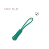 A green plastic zipper pull is shown next to the number 2.