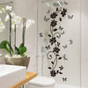 Black flower butterfly wall sticker applied to a glass shower door