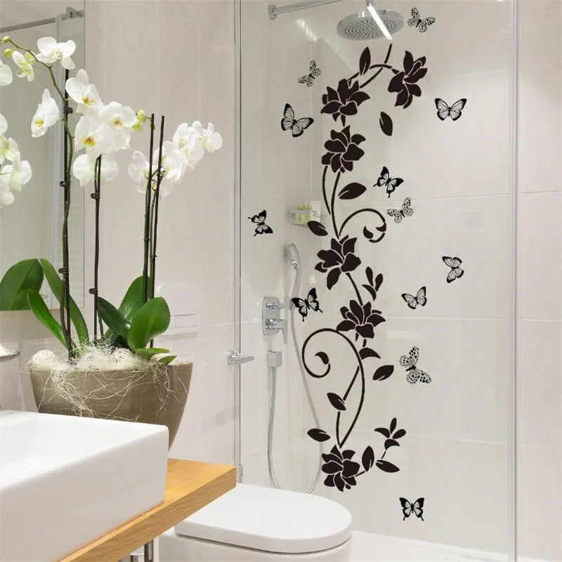 Black flower butterfly wall sticker applied to a glass shower door