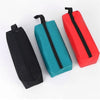 Three tool organizer bags in black, teal, and red with zippers displayed on a white background.