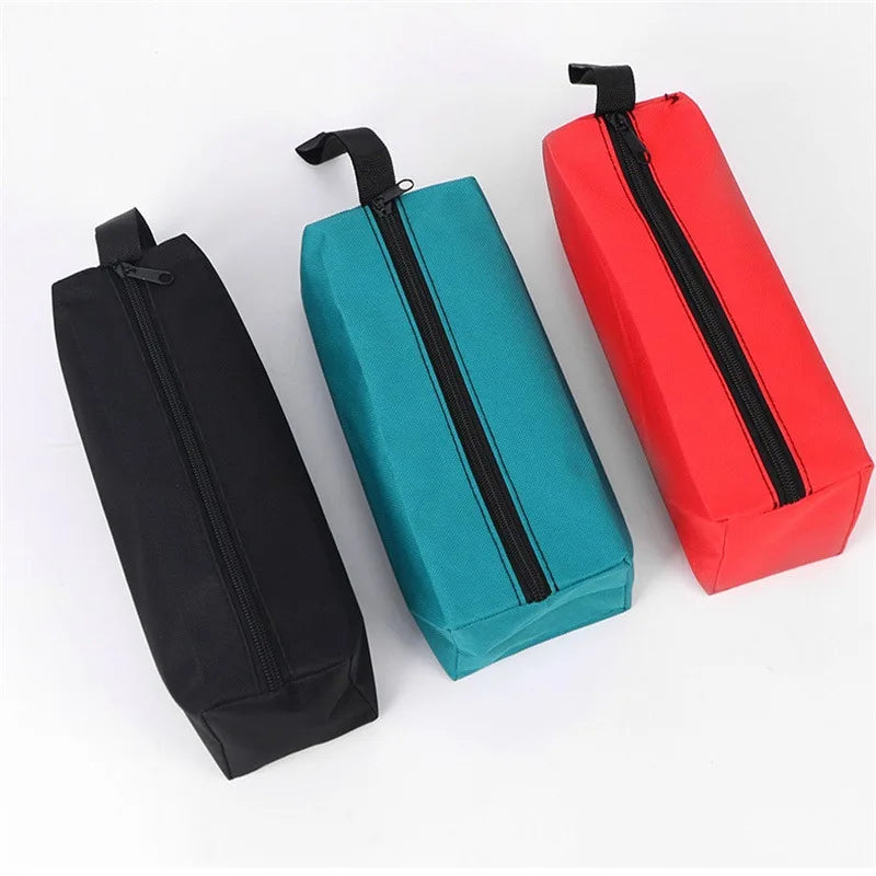 Three tool organizer bags in black, teal, and red with zippers displayed on a white background.