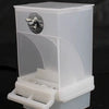 A transparent anti-spill parrot feeder with a clear plastic container and a visible opening.
