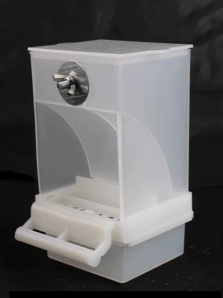A transparent anti-spill parrot feeder with a clear plastic container and a visible opening.