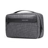 A dark gray waterproof travel toiletry bag with a black handle and a name tag displaying MARK RYDEN.