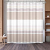 A beige and white striped waffle weave shower curtain hanging on a rod.