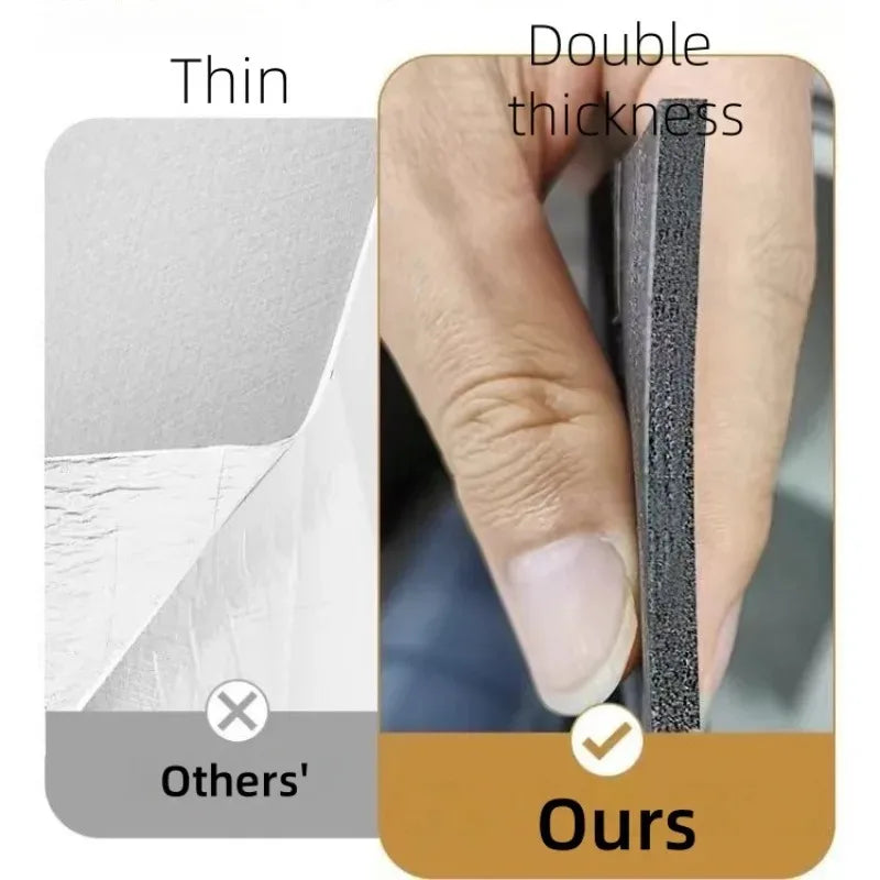 Close-up of a thin, dark gray self-adhesive wood grain wallpaper being applied to a surface.