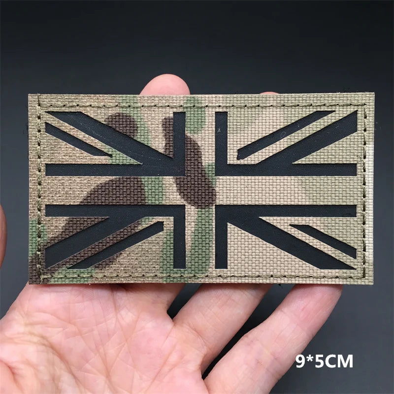 A black silhouette of the Union Jack flag cut into a rectangular patch with hook-and-loop backing