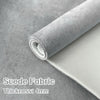 Roll of gray suede fabric with a foam backing showing the thickness of 4mm