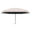 A beige compact travel umbrella with a black canopy and a visible handle.