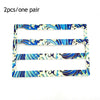 A pair of racing style license plate frames featuring a blue and white swirling wave design.
