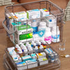 A transparent plastic first aid storage box with a handle filled with various medical supplies and medications.