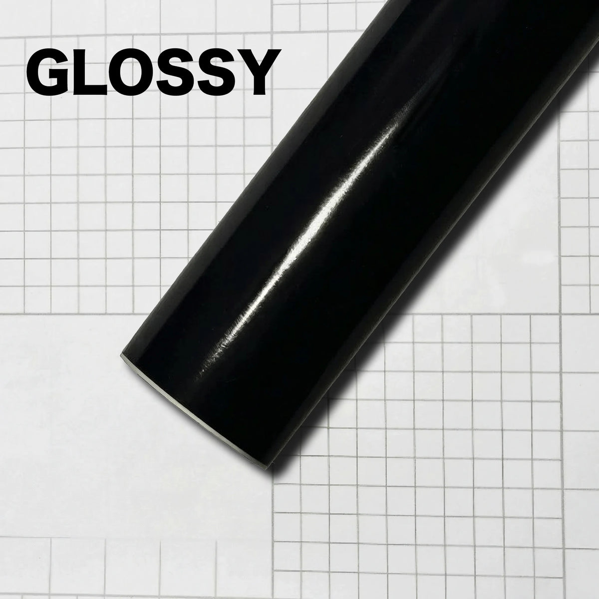 Glossy black carbon fiber vinyl wrap film shown diagonally on a white grid background.