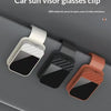 Three car sun visor glasses clips made of ABS material are shown in white, black, and pink on a gray car interior.