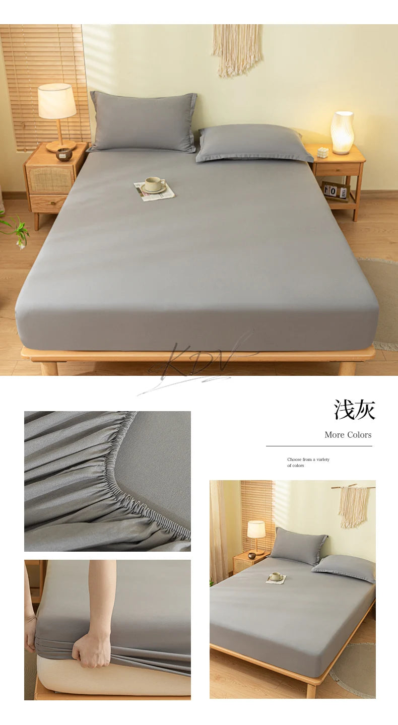 A gray fitted bed sheet set and pillowcase displayed on a wooden bed frame in a bright bedroom setting.