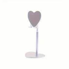 A silver adjustable heart-shaped stand for holding a phone or tablet.