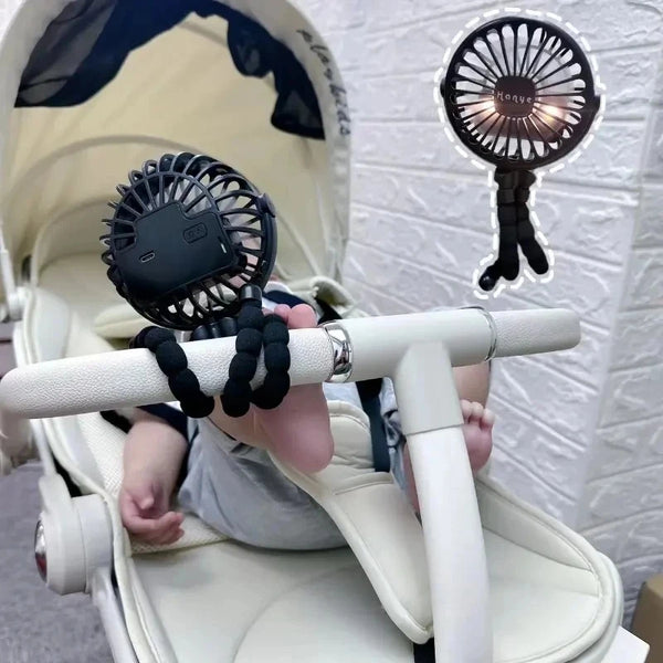 A portable USB desktop folding fan is shown being held by a baby in a white high chair.