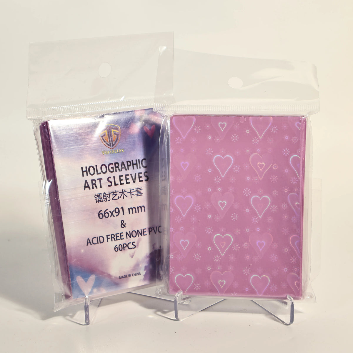 A clear plastic package containing 60 holographic heart-shaped art sleeves for trading cards.