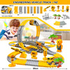 A yellow and gray engineering vehicle track set for children featuring various components and a yellow toy truck.