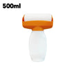 Wall paint repair roller with an orange handle and a white refillable bottle.
