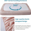 A pink linen fitted sheet with an elastic wrapped design shown in a close-up view.