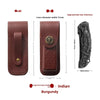A dark burgundy leather folding knife case with an intricate metal design and a protective sleeve.
