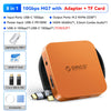 Boîtier NVMe SSD magnétique orange avec divers ports et un adaptateur sur fond noir.