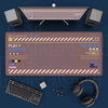 A Japanese art large mouse pad with a non-slip rubber base is displayed alongside a keyboard and headphones.