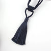 A set of two dark navy blue braided rope tassel curtain tiebacks